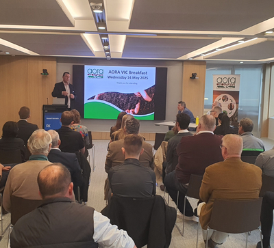 AORA-branded corporate event with guests networking.